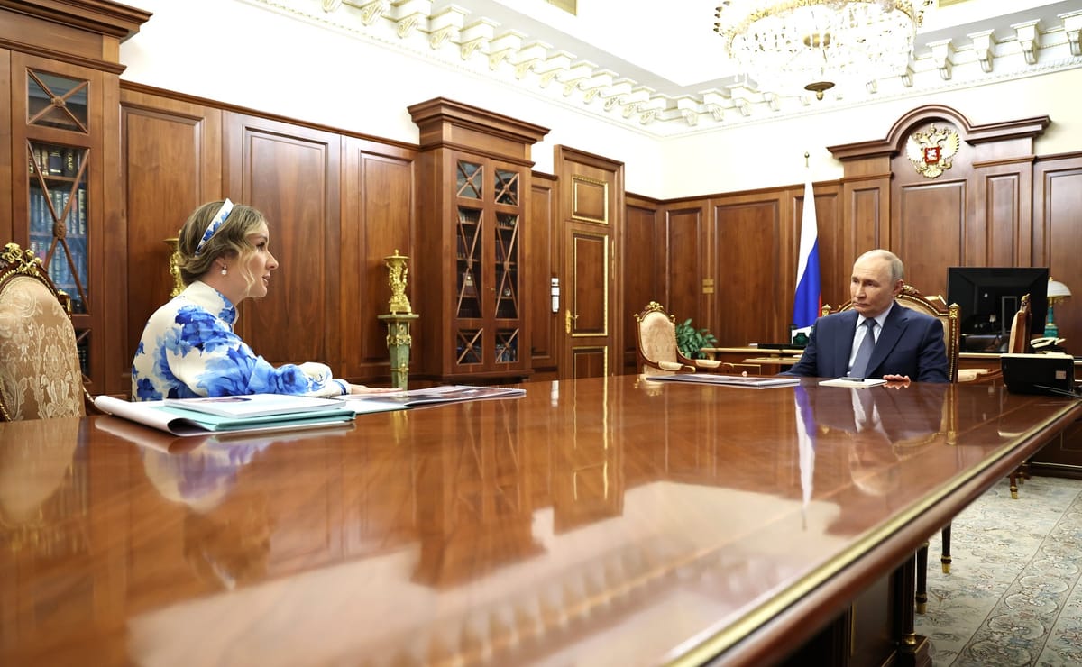 0738GMT//Putin mocks Ukraine's children claims; fake Siberian honey